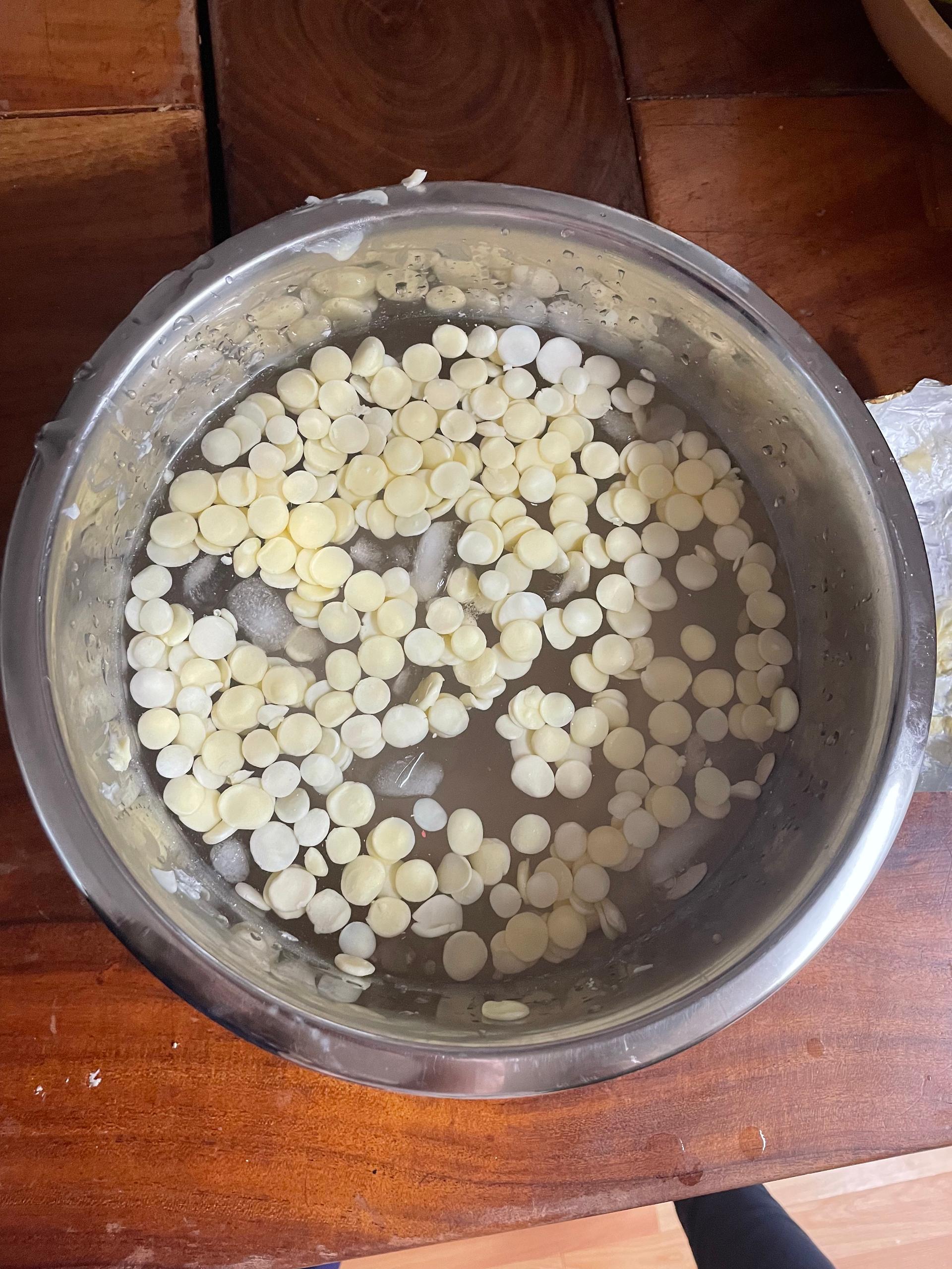 butter dots in a metal bowl with ice